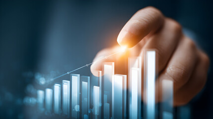 A hand hovering over a rising bar graph with a connecting line and a bright light on the top bar