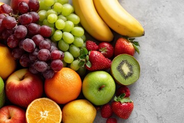 Vibrant Overhead Display Juicy Red Grapes Cluster, Exotic Variety Red Berries, Green Apples, Sliced Oranges, Showcasing Dietary Beauty Fresh Fruit Assortment Bunch