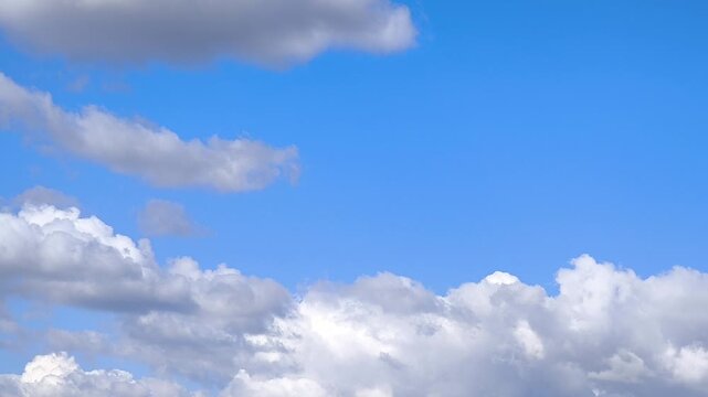 Small rather bright cumulus clouds