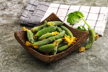 Raw gherkin cucumbers in the bowl