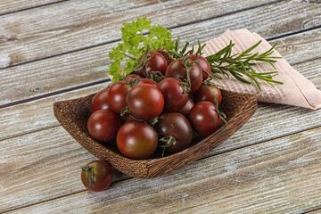 Juicy ripe black cherry tomato