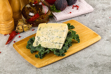 Blue cheese piece over board