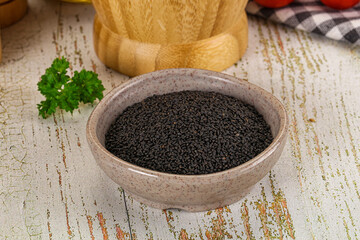 Black dry Nigella seeds in the bowl