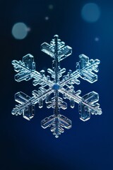Clear glass snowflake against dark background with bokeh light effect. Perfect for winter themes and holiday decorations.