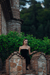 A beautiful lady walking through the grand halls of an ancient castle