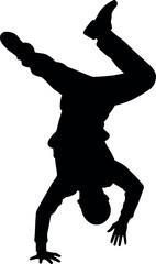 Silhouette of man performing handstand breakdance move