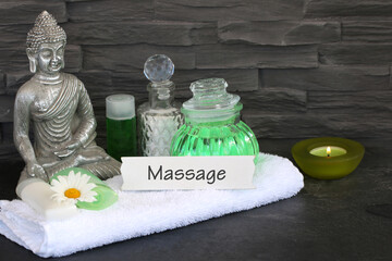 Buddha with accessories for wellness and massage.