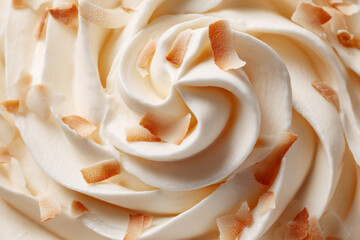 Swirls of creamy dessert topped with toasted coconut flakes in a delightful presentation