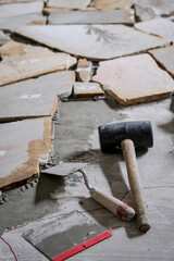Laying Polygonal Stone Slabs on Screed Floor with Adhesive and Tools