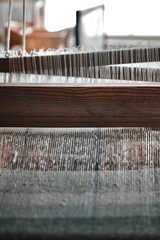 Close up image of a tapestry being created on an old loom