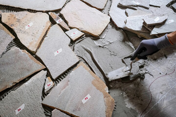 Laying Polygonal Stone Slabs on Screed Floor with Adhesive and Tools
