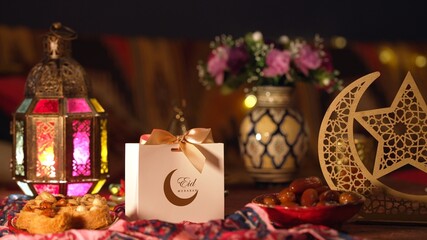 Delicious Ramadan sweets arranged beside a beautifully wrapped gift box