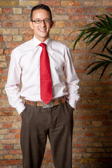 Gay Lifestyle: A Smart Smile. A relaxed portrait from a friendly man in a smart casual wear and a...