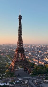 Experience Stunning Aerial Views of the Majestic Eiffel Tower in the Heart of Paris. Vertical video