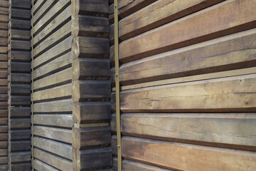 Close-up of modern wooden log construction with linear texture and visible grain details