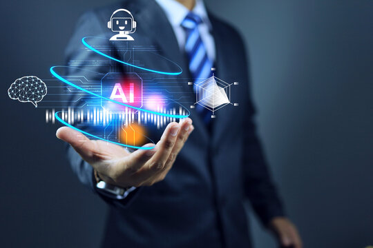 AI concept with businessman holding artificial intelligence in his hand to use it for business assisstance and help analyze data for investment