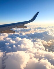 Obraz premium Airplane wing above fluffy clouds