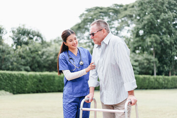 Home caregiver supports elderly man with walker outdoors, providing compassionate assistance and...