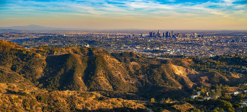 Panorama of Griffith Observatory and Los Angeles skyline photographed from Mount Lee at sunset.