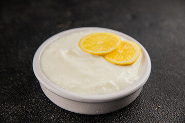Lemon yogurt natural product skyr sour milk skir fresh delicious gourmet food background on the table rustic food top view copy space keto and paleo diet vegetarian food