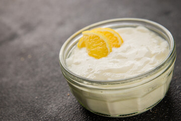 Lemon yogurt natural product skyr sour milk skir fresh delicious gourmet food background on the table rustic food top view copy space keto and paleo diet vegetarian food