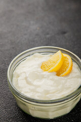 Lemon yogurt natural product skyr sour milk skir fresh delicious gourmet food background on the table rustic food top view copy space keto and paleo diet vegetarian food