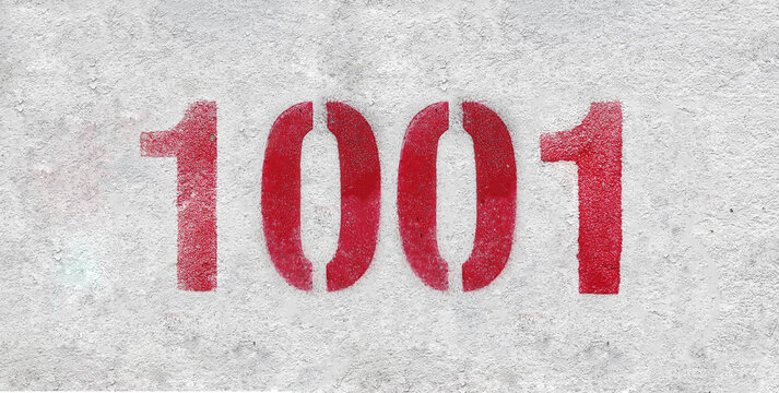 red spray-painted number 1001 sprayed onto a white wall.