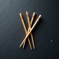Wooden chopsticks arranged on slate