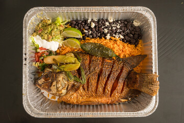 Whole fried fish with black beans