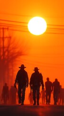 Silhouetted Figures Walking Towards a Setting Sun Through an Orange Haze