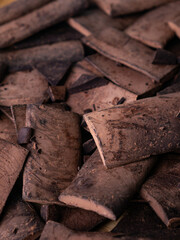 Chunk of cacoa mass bar or cocoa liquor. 100% pure cocoa chocolate.
