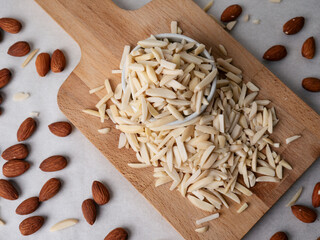 Almond and White Almond Stick set on wooden board and white background.