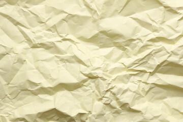 Crumpled yellow paper background texture