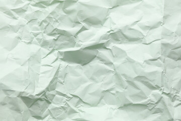 Crumpled mint green paper background texture
