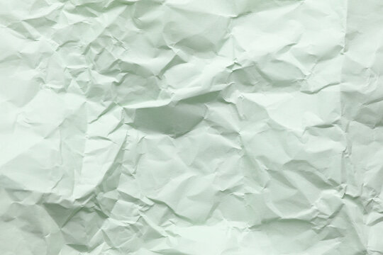 Crumpled mint green paper background texture