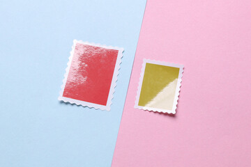 Blank Postal paper adhesive stamps on pink blue background. Marks for letter