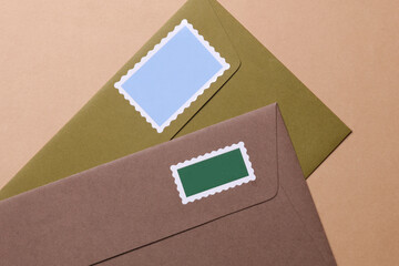 Envelopes with postage stamps on brown background