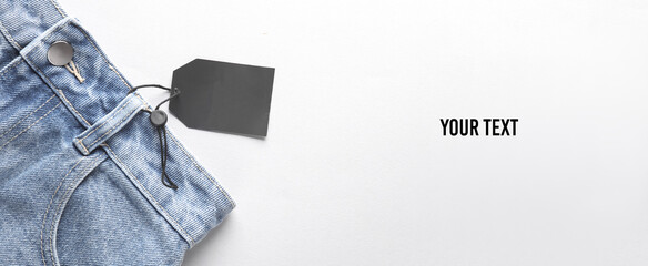 Sale, black friday. Blue jeans with black sale tag with space for your text