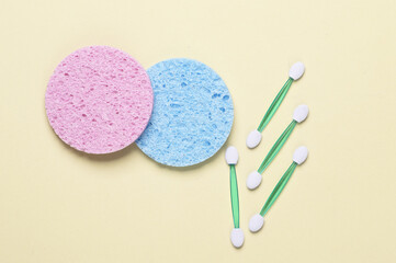 Remover spongesand applicators for makeup on yellow background. Beauty products. Top view. Flat lay