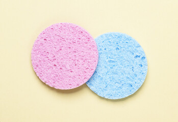 Make-up remover sponges on yellow background