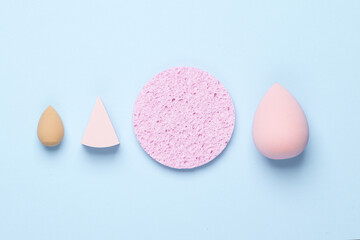 Remover sponge and make-up blenders on a blue background. Beauty concept