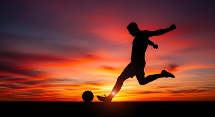 A soccer player kicks the ball at sunset in silhouette