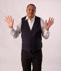 Adult male wearing elegant blazer, matching formal wear in studio shot with white background and making various facial expressions of mixed feelings