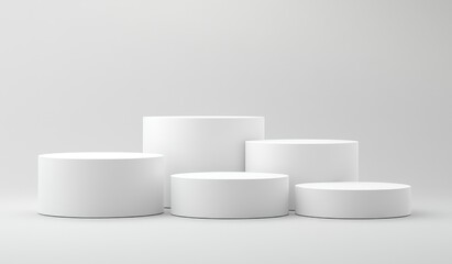 Five White Cylindrical Podiums of Varying Heights on a White Background Studio Shot