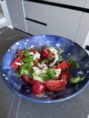 Fresh tomato burrata salad with basil and arugula