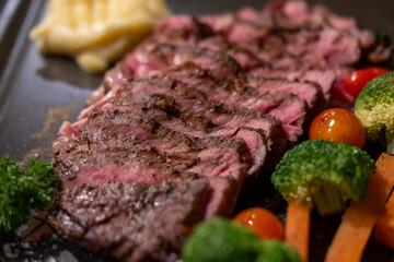 Medium rare rib eye angus steak served on plate