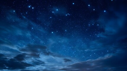 Starry night sky with clouds.