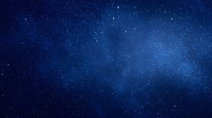 Obraz premium Deep blue night sky filled with numerous stars.