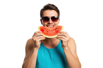 Happy young man in sunglasses smiling and biting into a refreshing slice of watermelon.