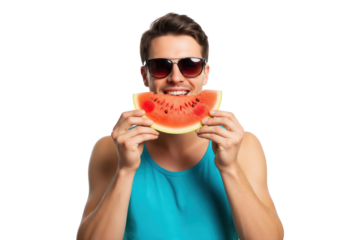 Happy young man in sunglasses smiling and biting into a refreshing slice of watermelon.